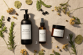 Bloom Root Ritual 3-step hair system bundle — shampoo, leave-in spray and hair masque arranged together with botanicals