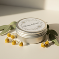 Bloom Mama Nursing Balm in silver screw-top tin with botanical styling
